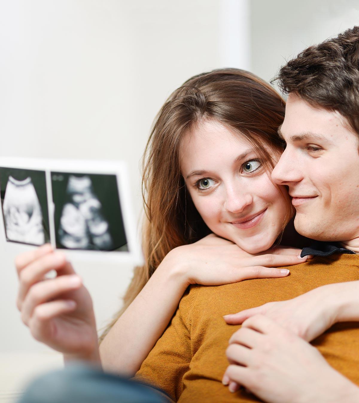 A pregnant lady and her husband are looking the sonography