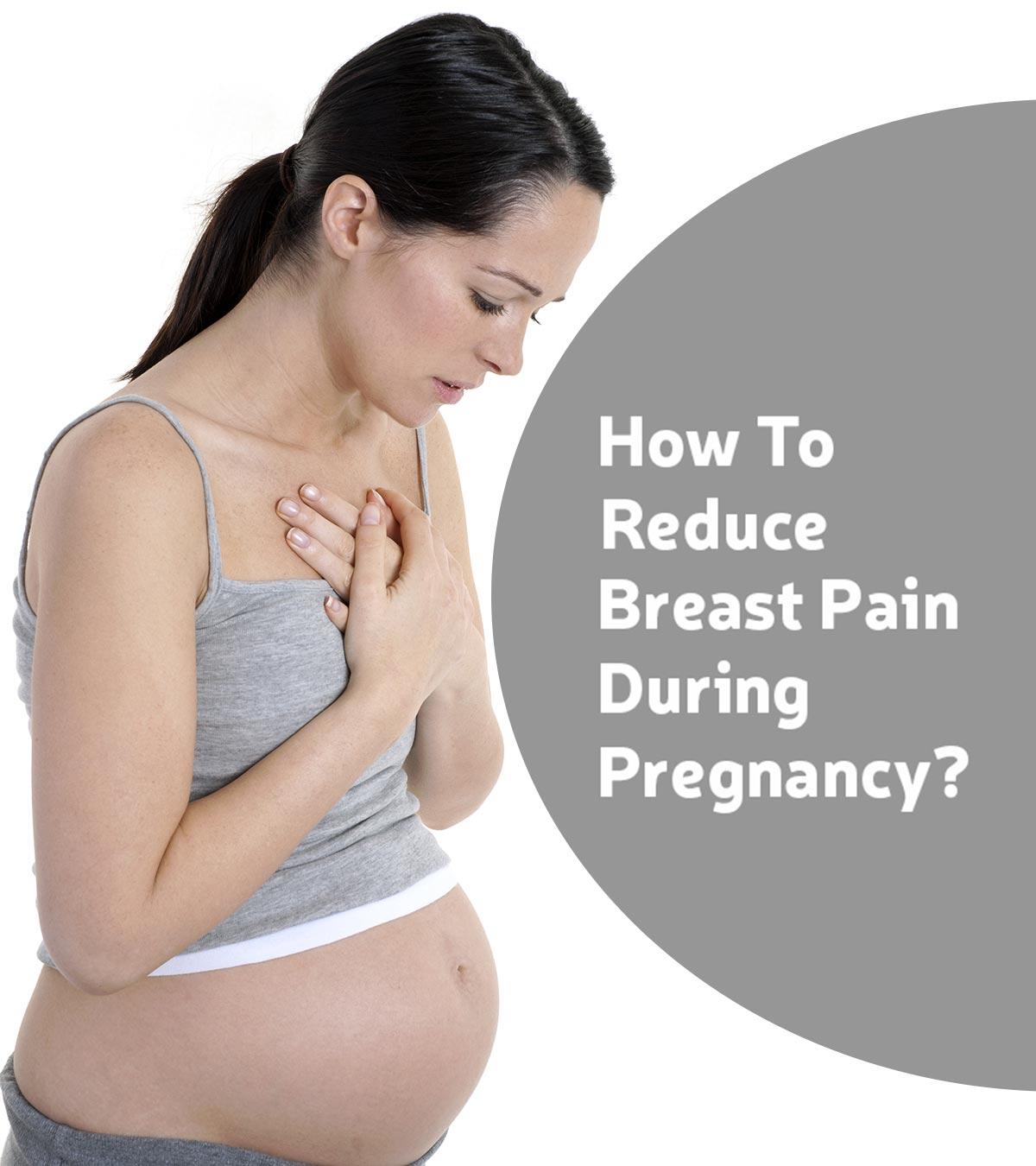 Pregnant woman gently massaging her breasts to alleviate pain