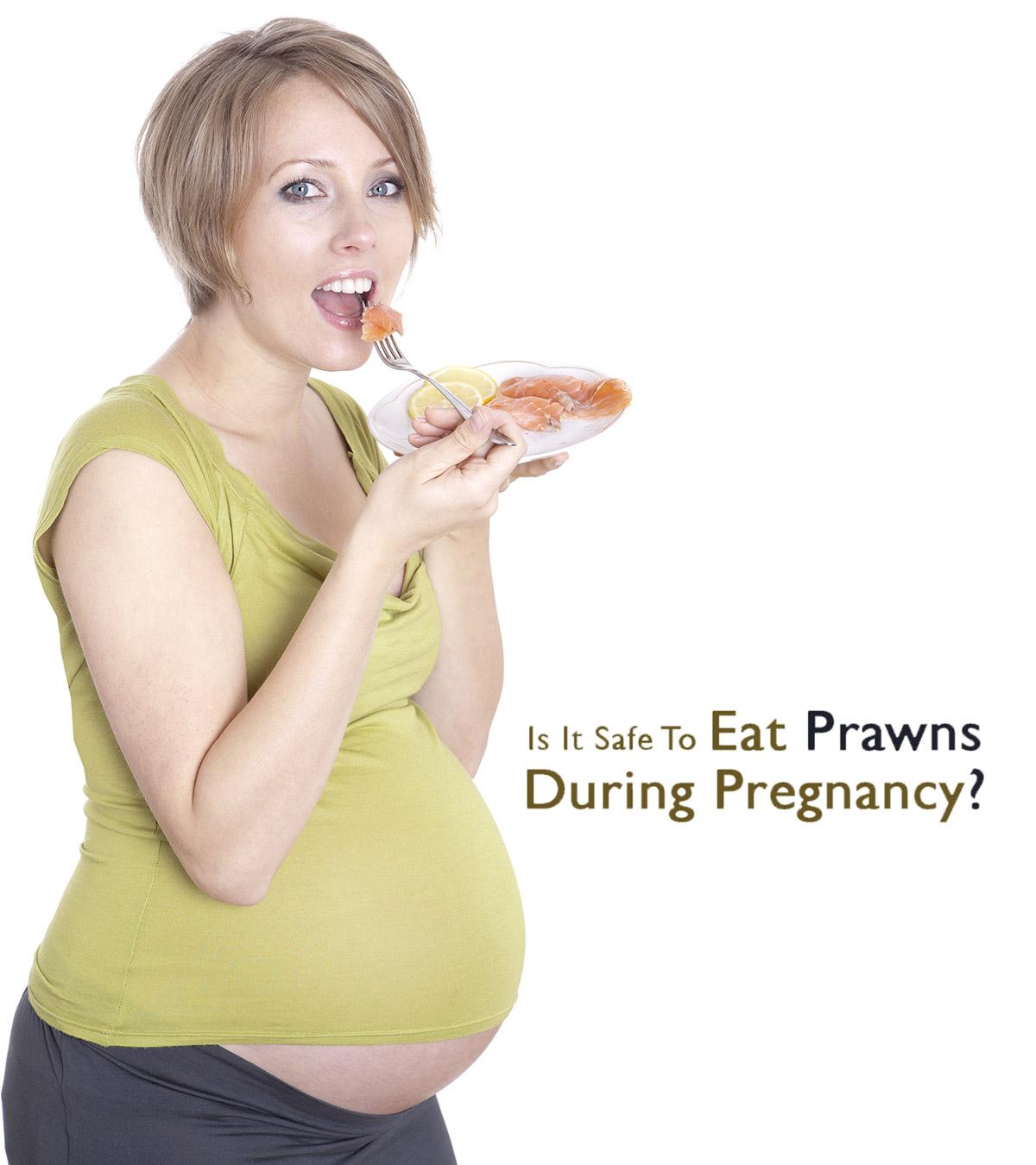A pregnant lady eating prawn