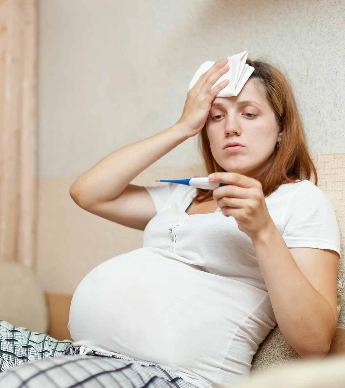A pregnant lady checking her body temperature