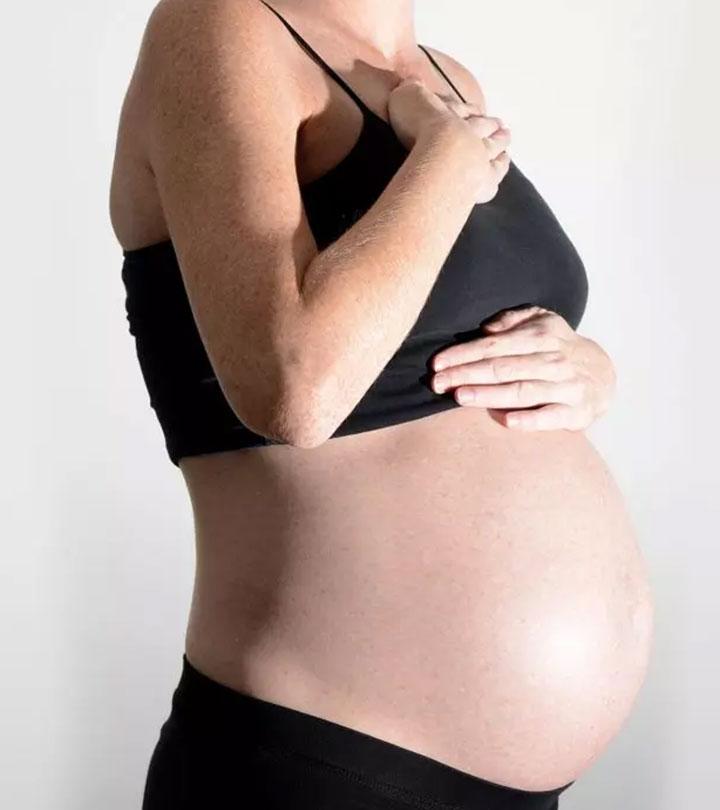 Pregnant Woman Taking Care Of Her Breasts