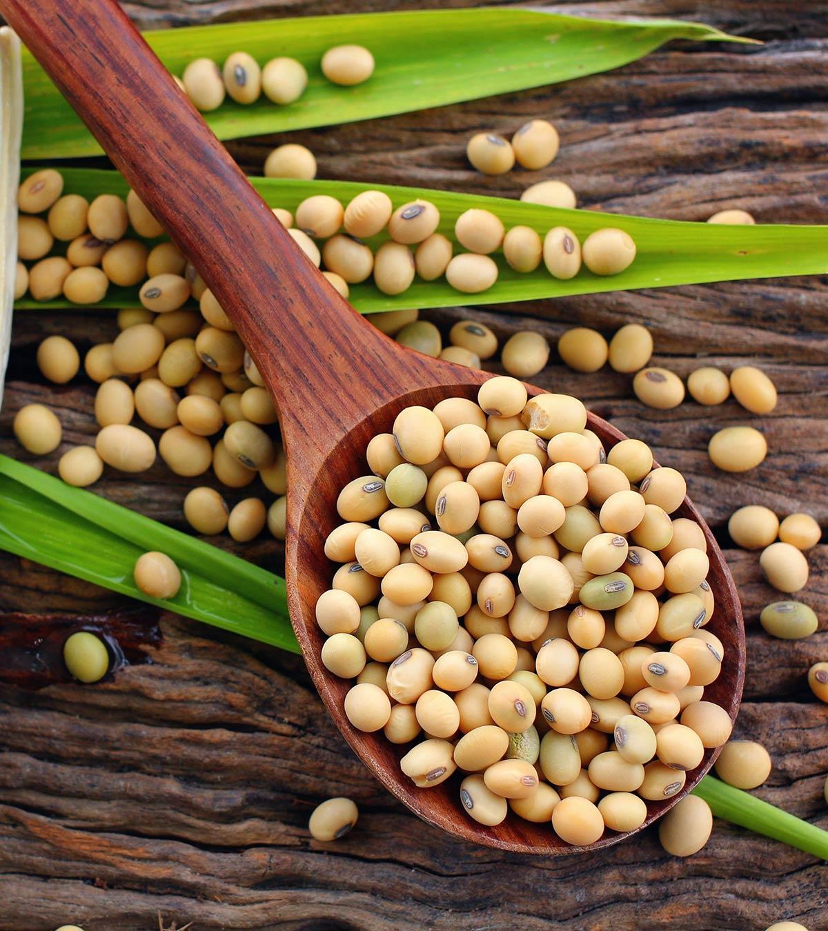 Lots of soybeans on a wooden spoon
