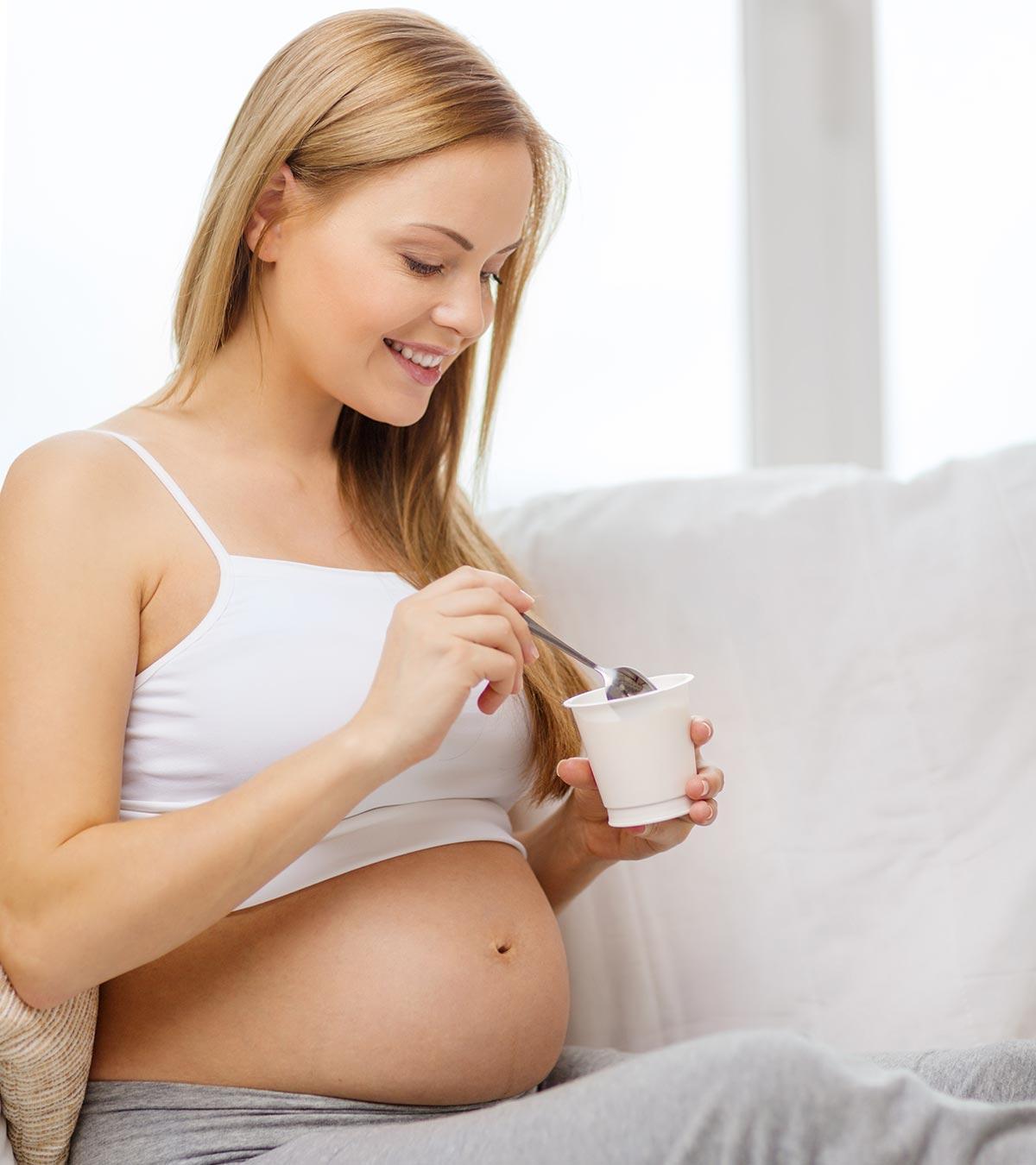 Pregnant Woman Eating Yogurt