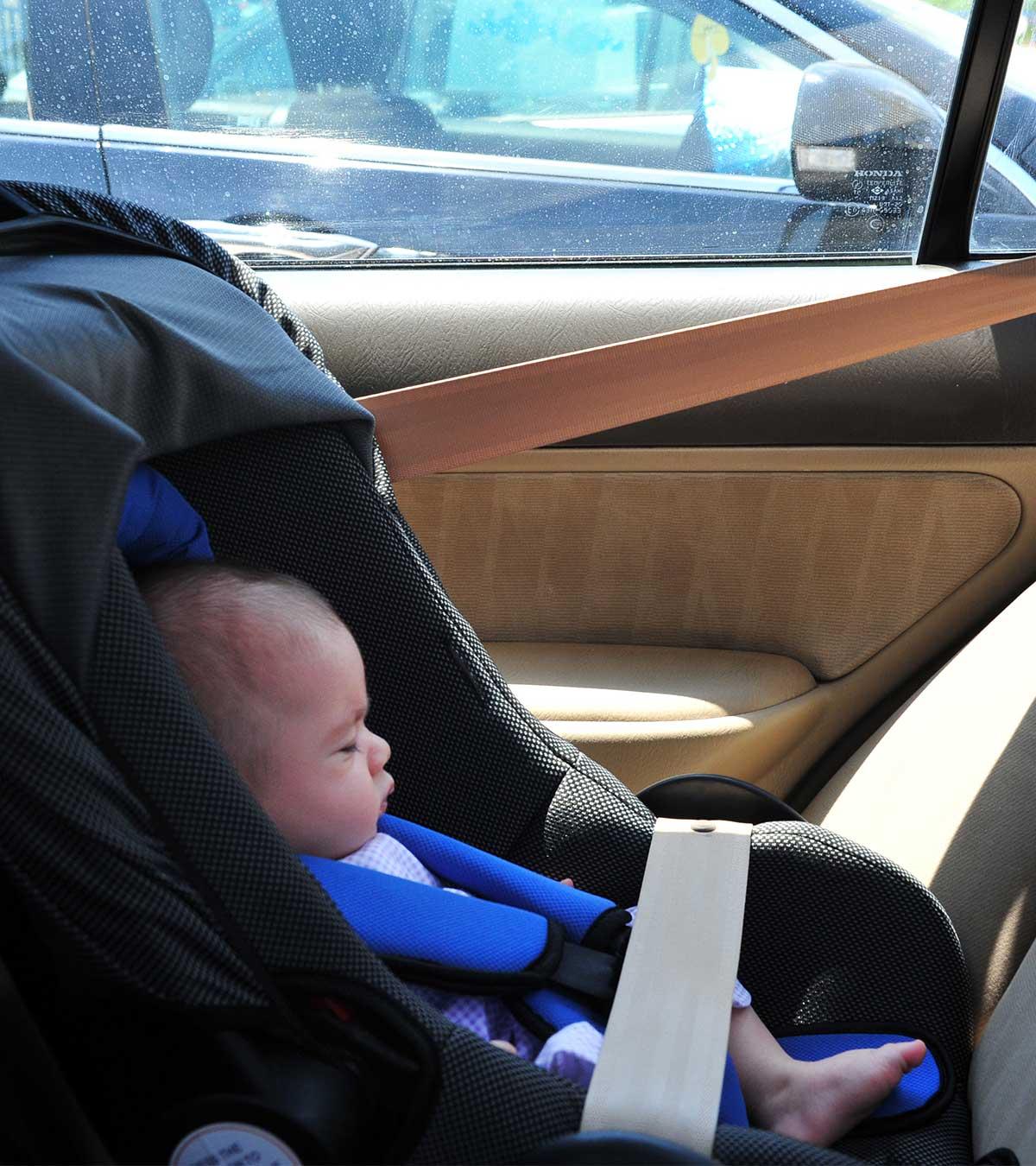 Baby Looking Distressed, Indicating Symptoms Of Heat Stroke