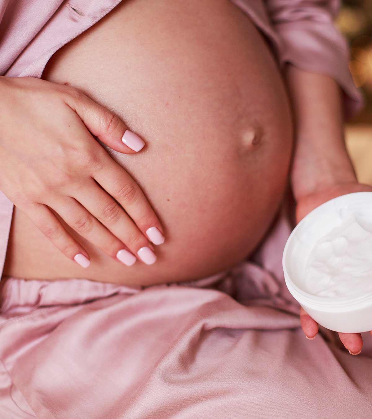 A Pregnant Woman Applying Home Remedy On Darken Skin