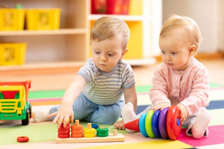 Toddler playing with toys