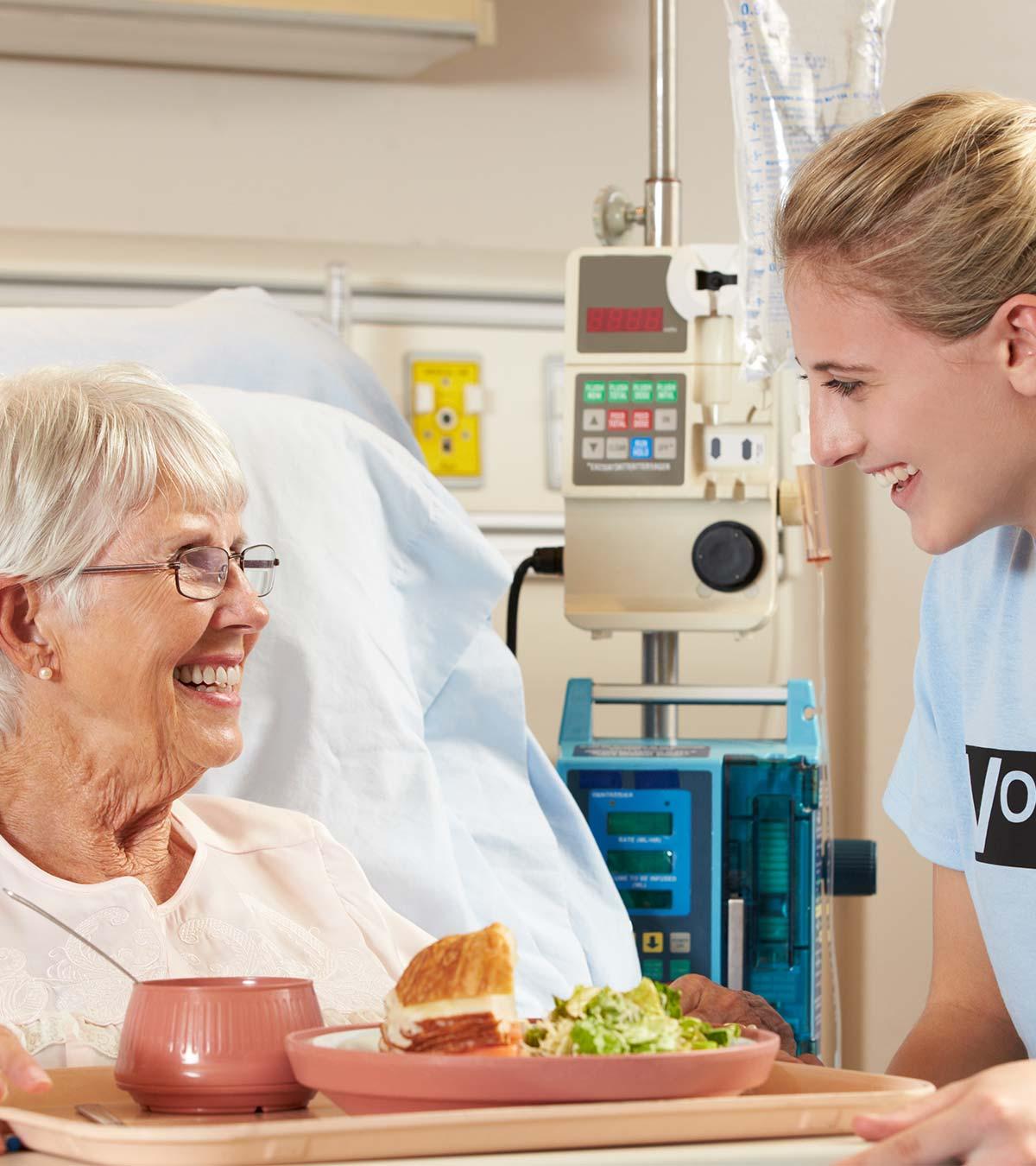 A Teenager Feeding Food For Old Woman