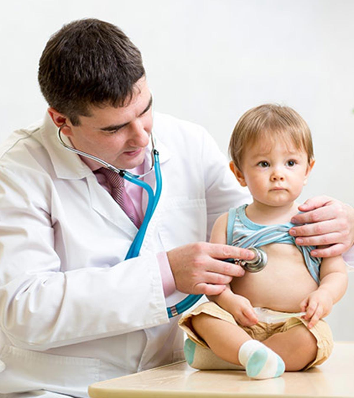 A doctor checking stomach flu in a toddler