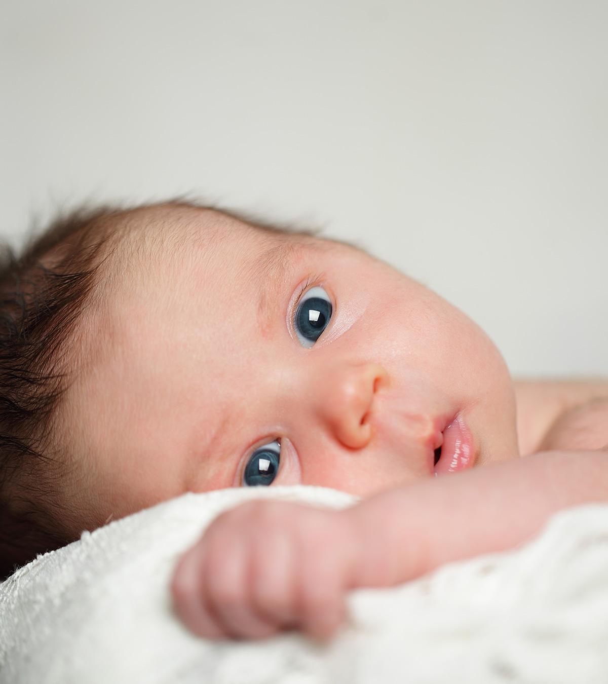 A newborn baby is staring
