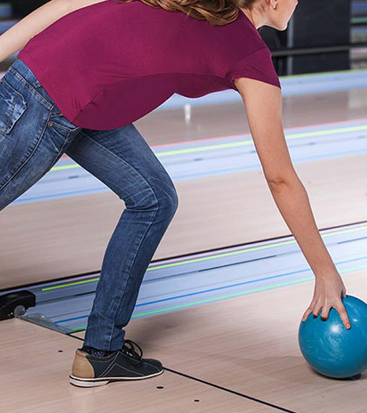 A pregnant lady bowling