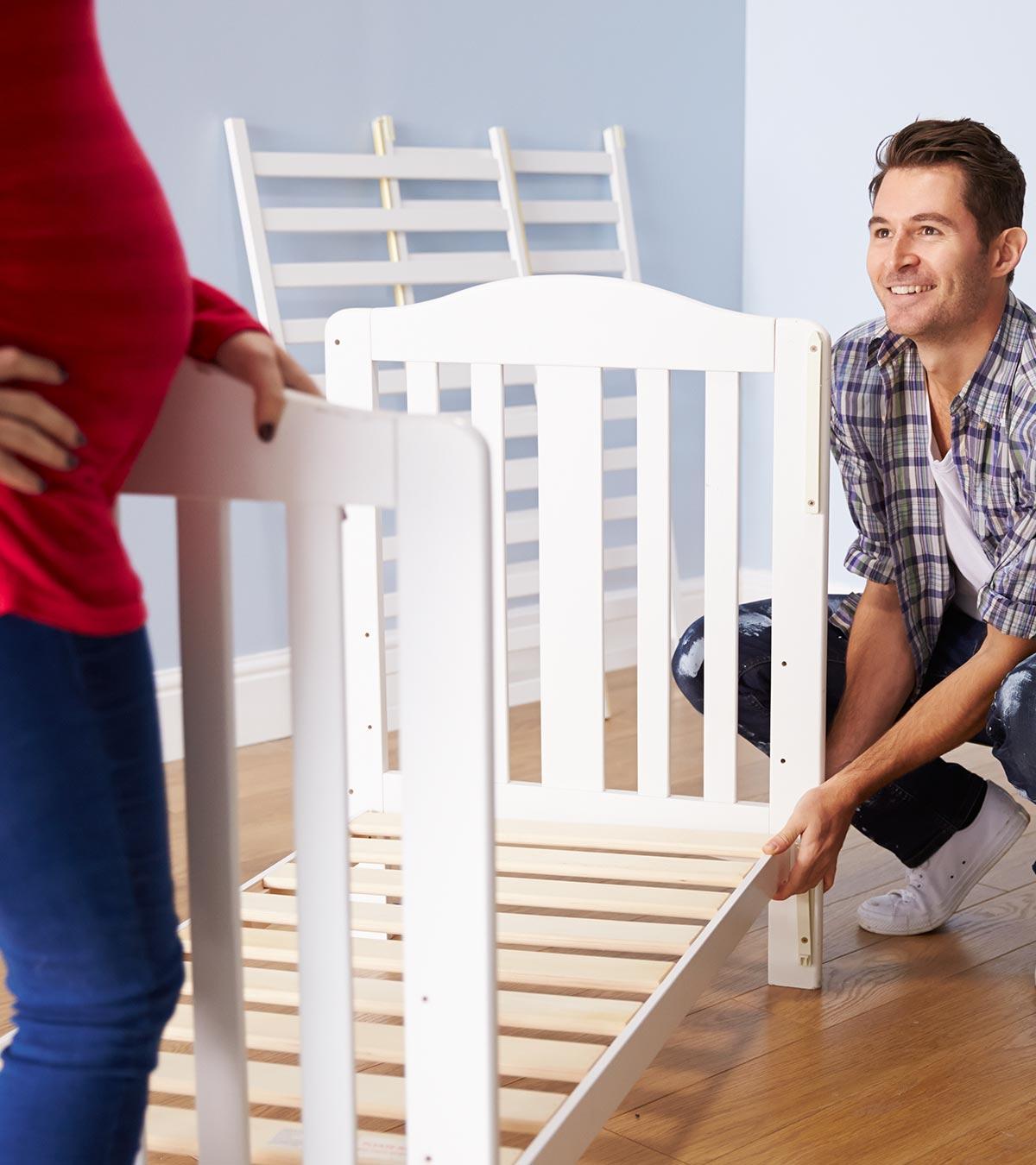 A woman is moving furniture while pregnant