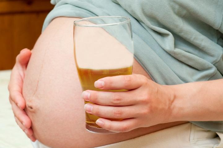 pregnant woman drinking ginger ale