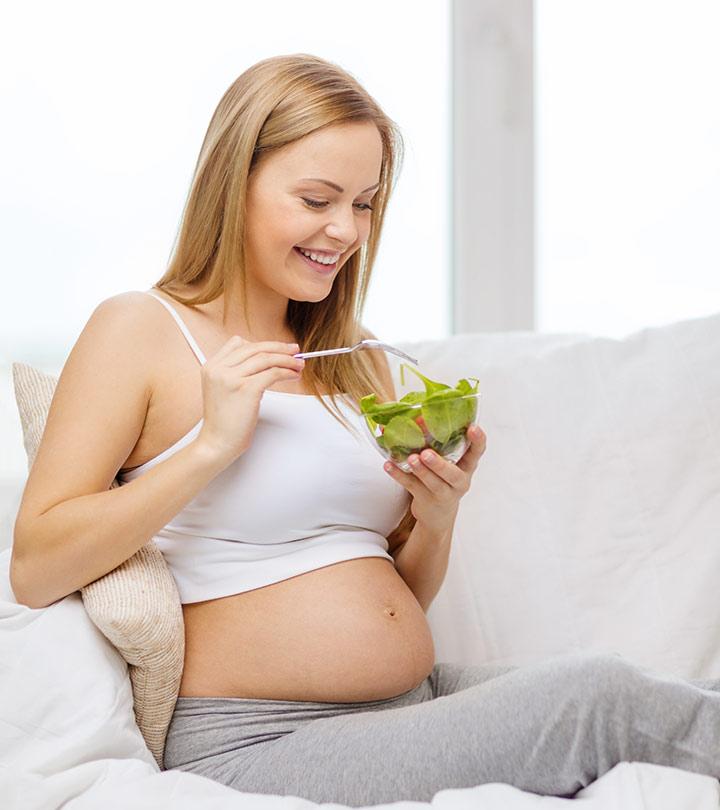 A Pregnant Woman Eating Spinach