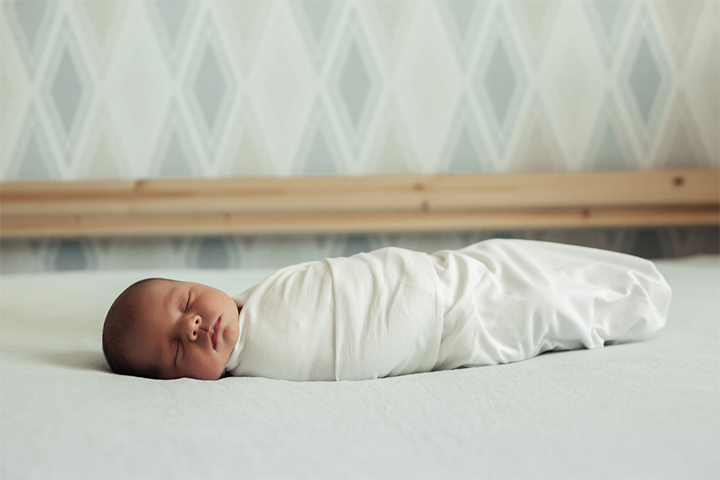 Swaddling a newborn may help them sleep better