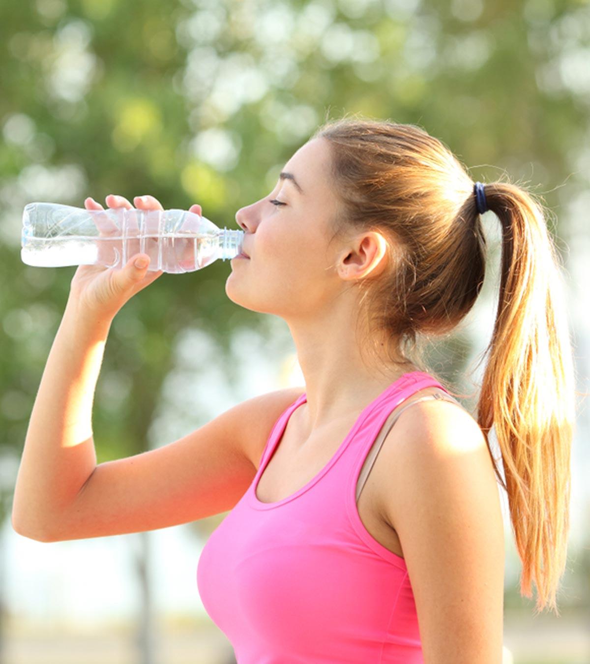 A teenage girl drinking water