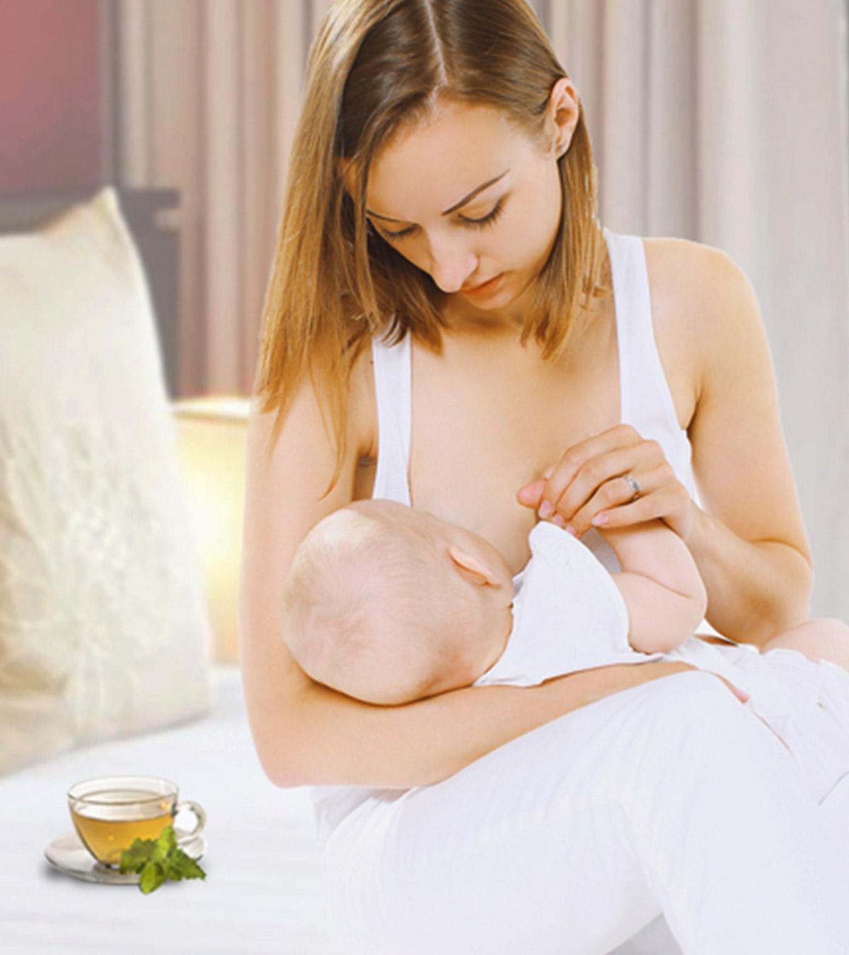 A lady breastfeeding her baby