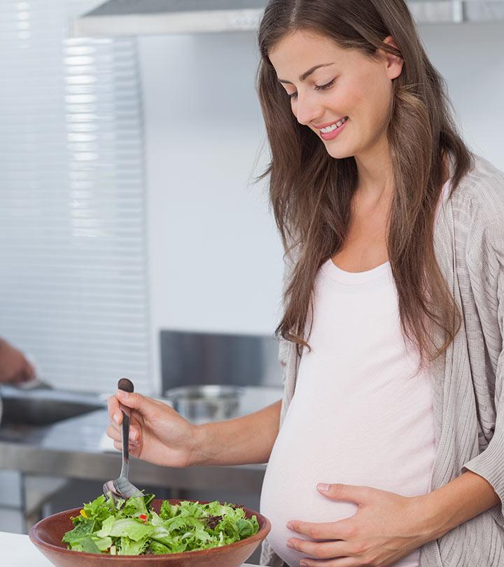 Pregnant Woman Eating Raw Vegetables