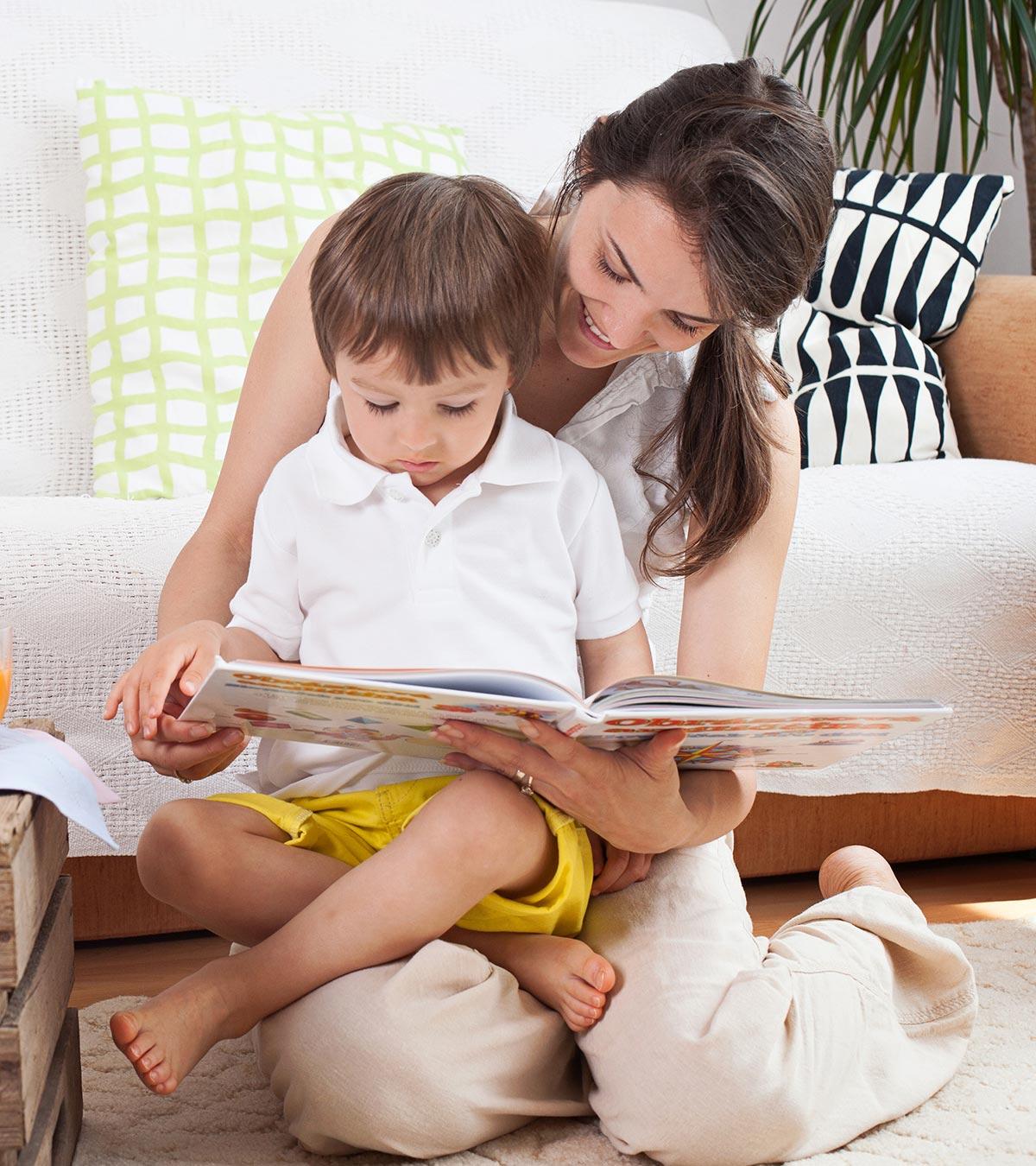 Mom reading books with her 13-month-old baby
