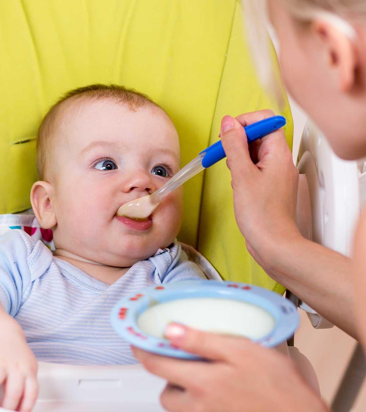 Mother Feeding Rice Water For Baby