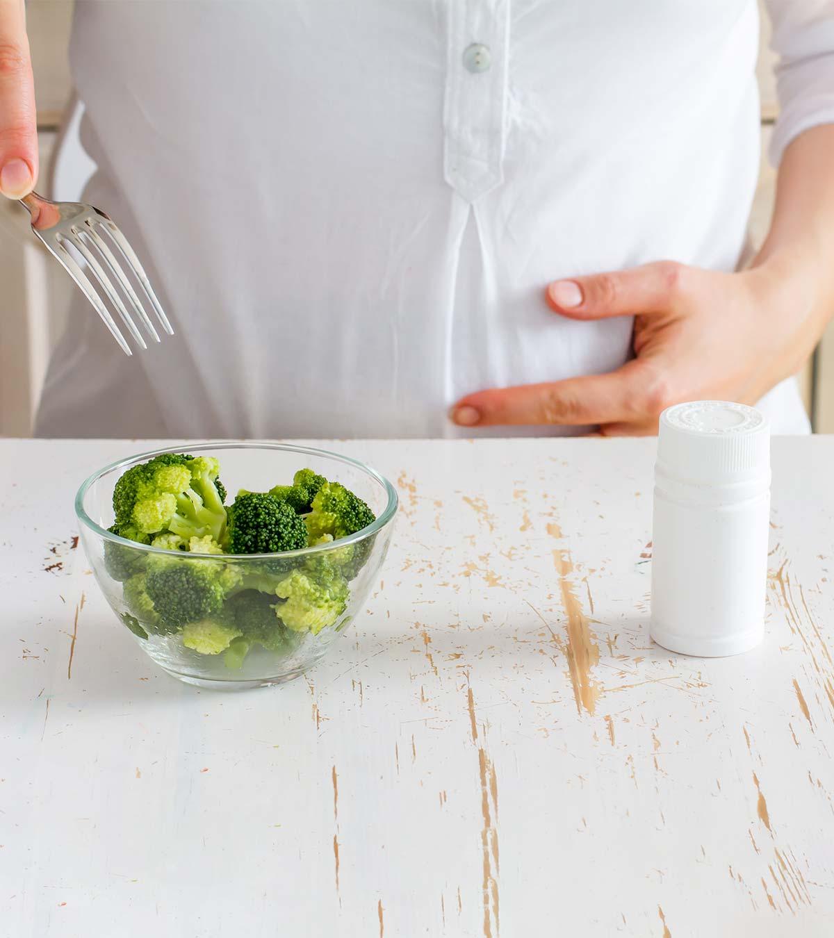 Pregnant Woman Eating Broccoli