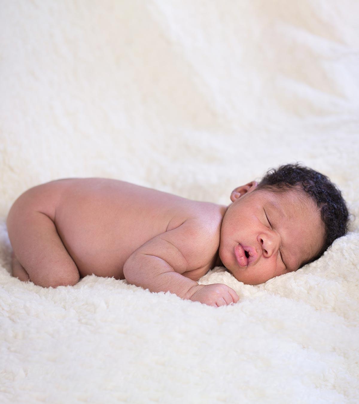 A small baby is slee