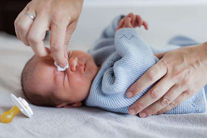 Baby rubbing sales nose and crying