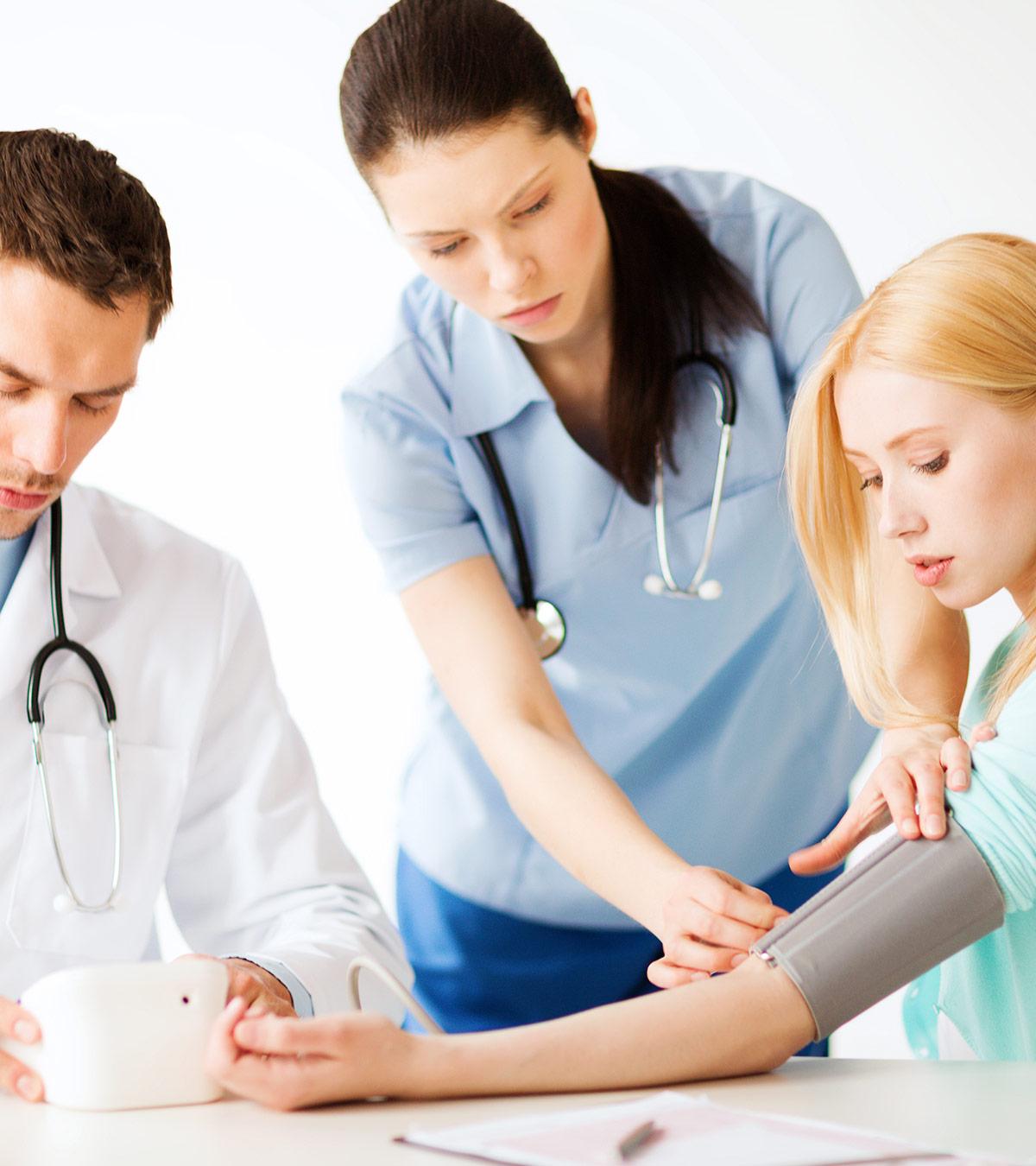 A doctor checking a teenage girl