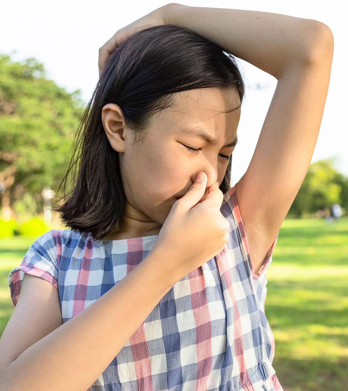 A Girl Smelling Body Odor