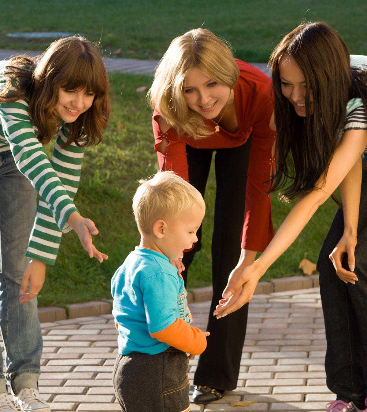 A small kid with some girls