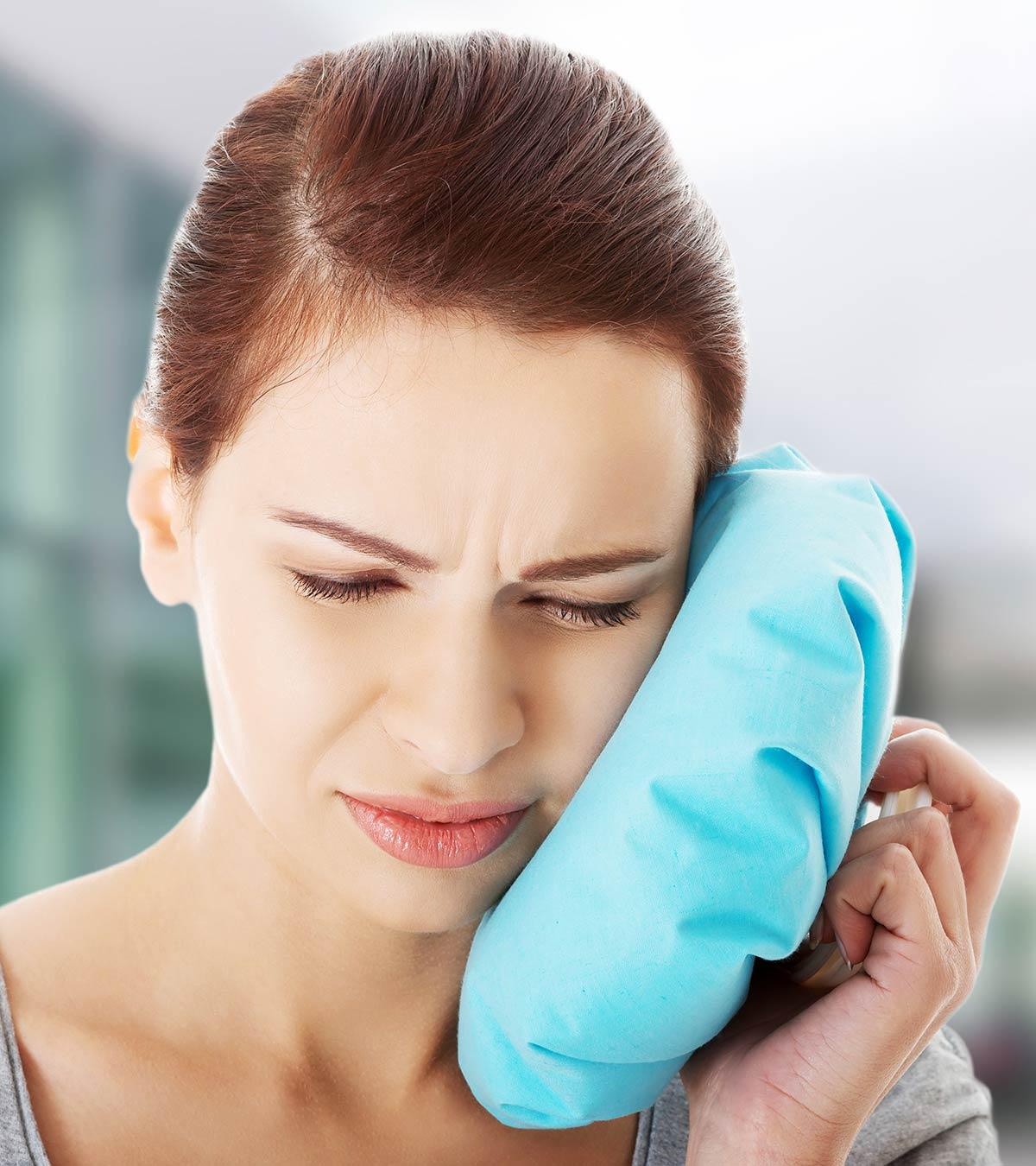 Mother Breastfeeding With Wisdom Teeth Pain