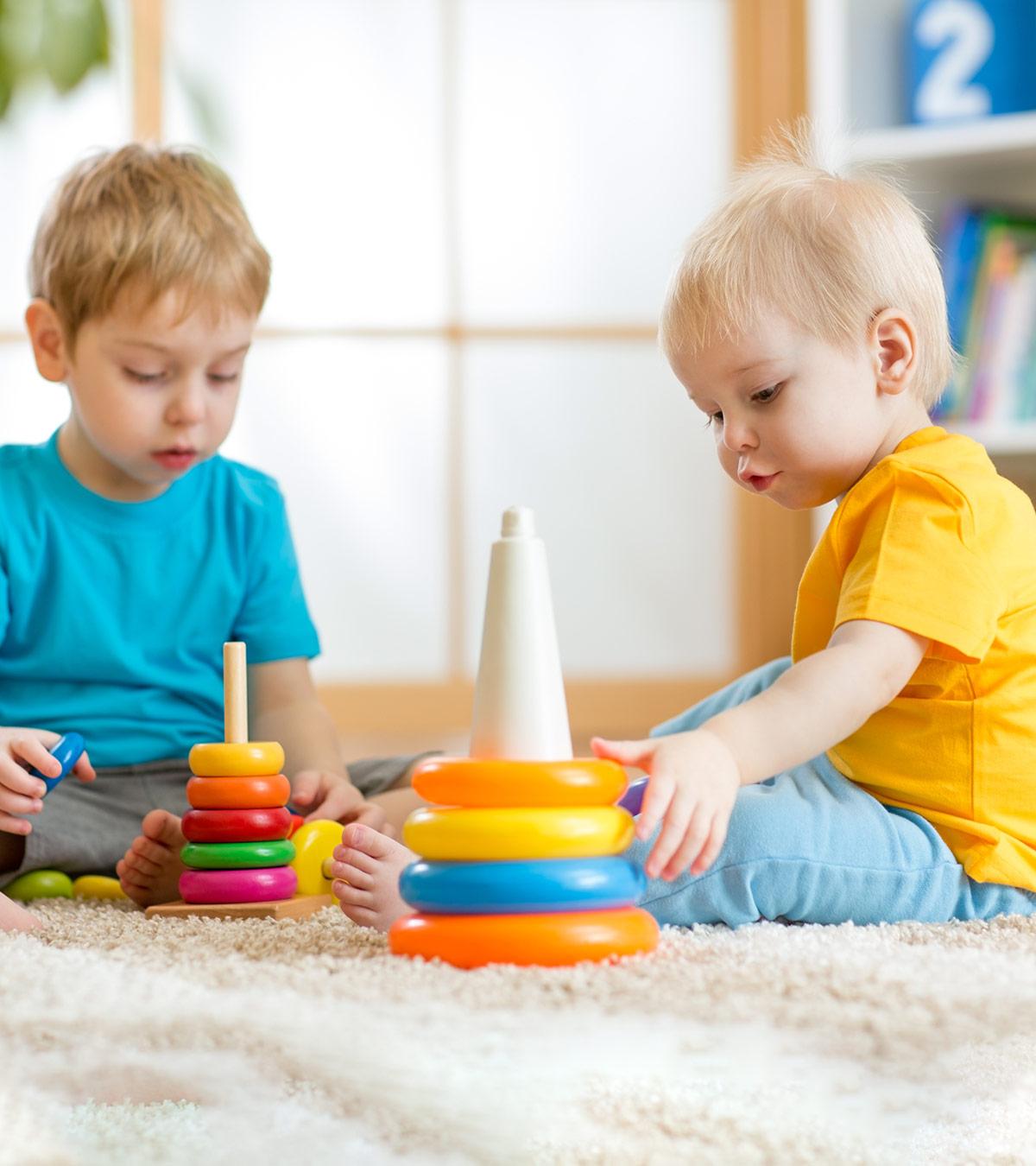 Two babies are playing