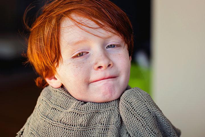 Boy with cool diagonal fringe hairstyle posing.