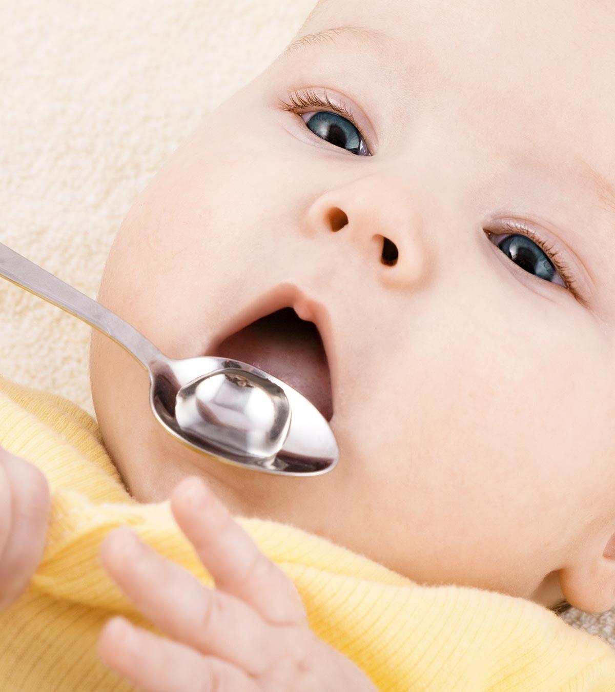 A Mom Feeding Peppermint Water For Baby