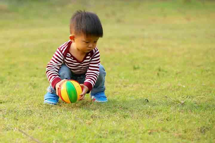 23 months old baby will bend down to pick something up