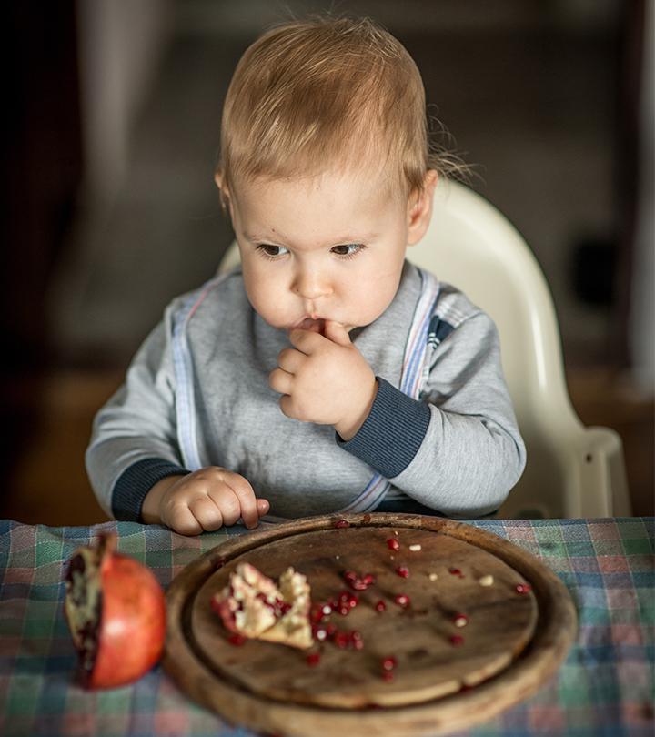 Baby Eating Pomegranate