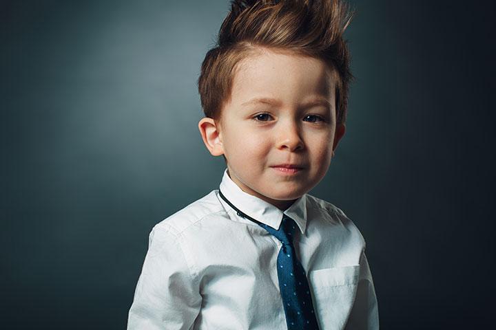 Smiling boy with edgy vertical haircut.