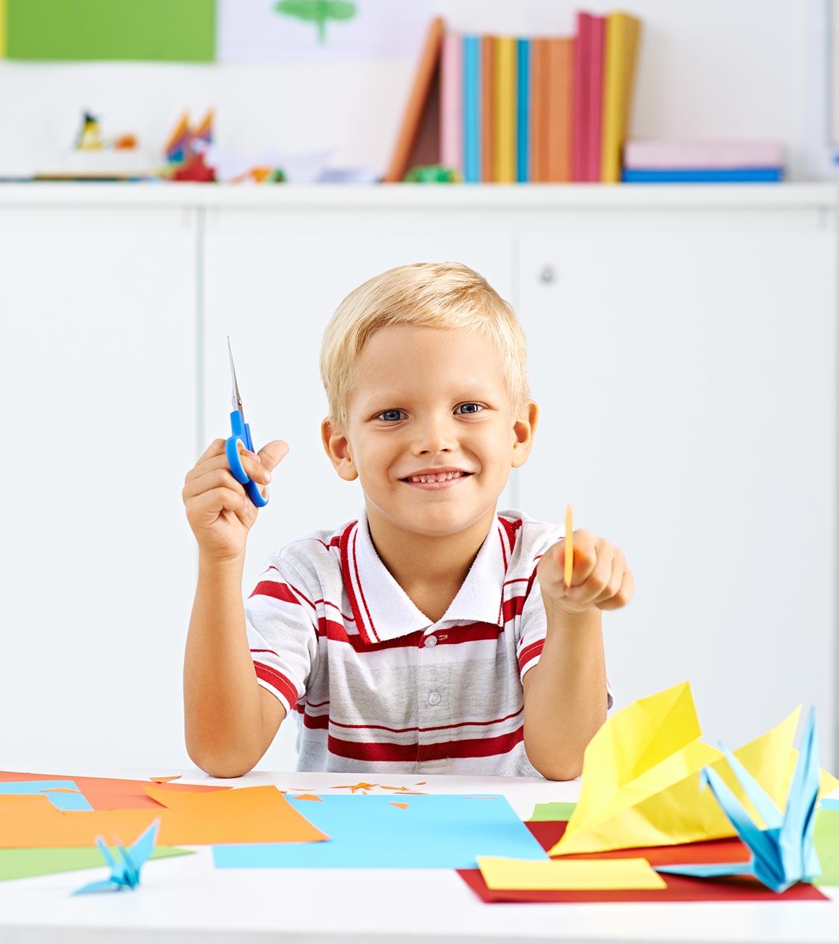 Kid Making Origami Craft