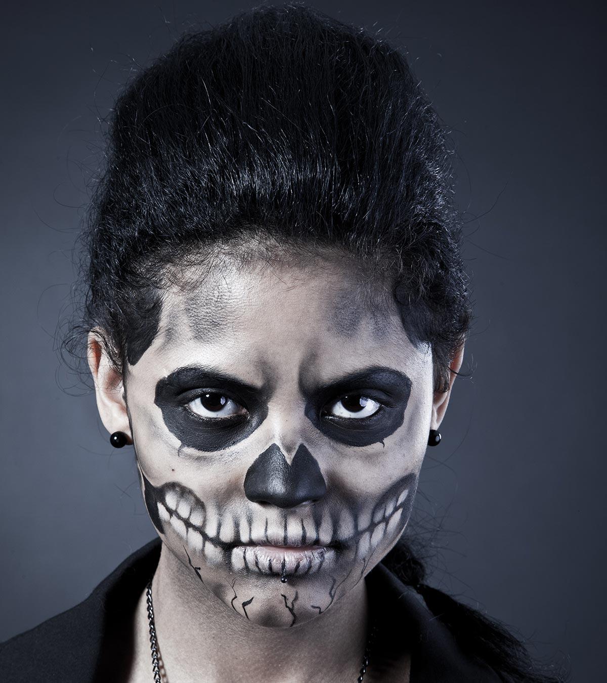 A kid painted her face for Halloween