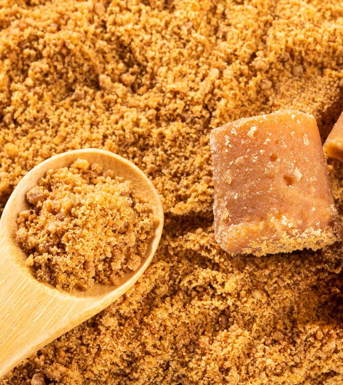 Jaggery powder in a wooden spoon