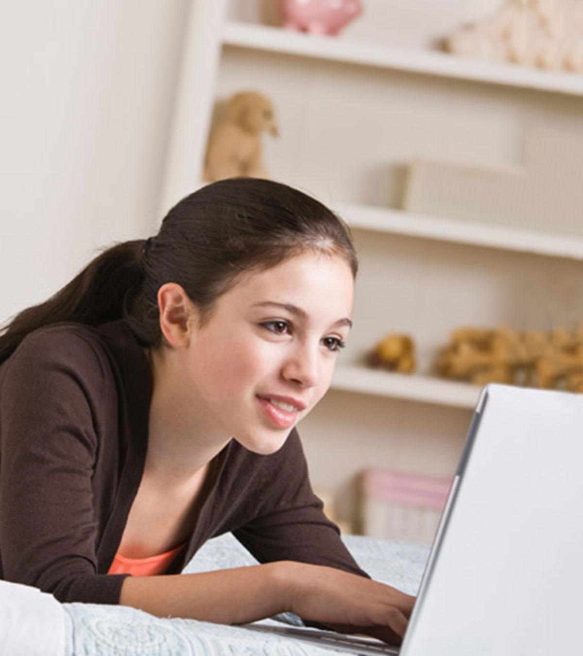Teen Playing Virtual World Games On A Computer
