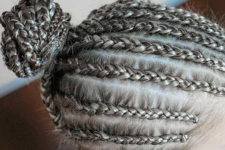 Cornrows bun hairstyle for black teenager