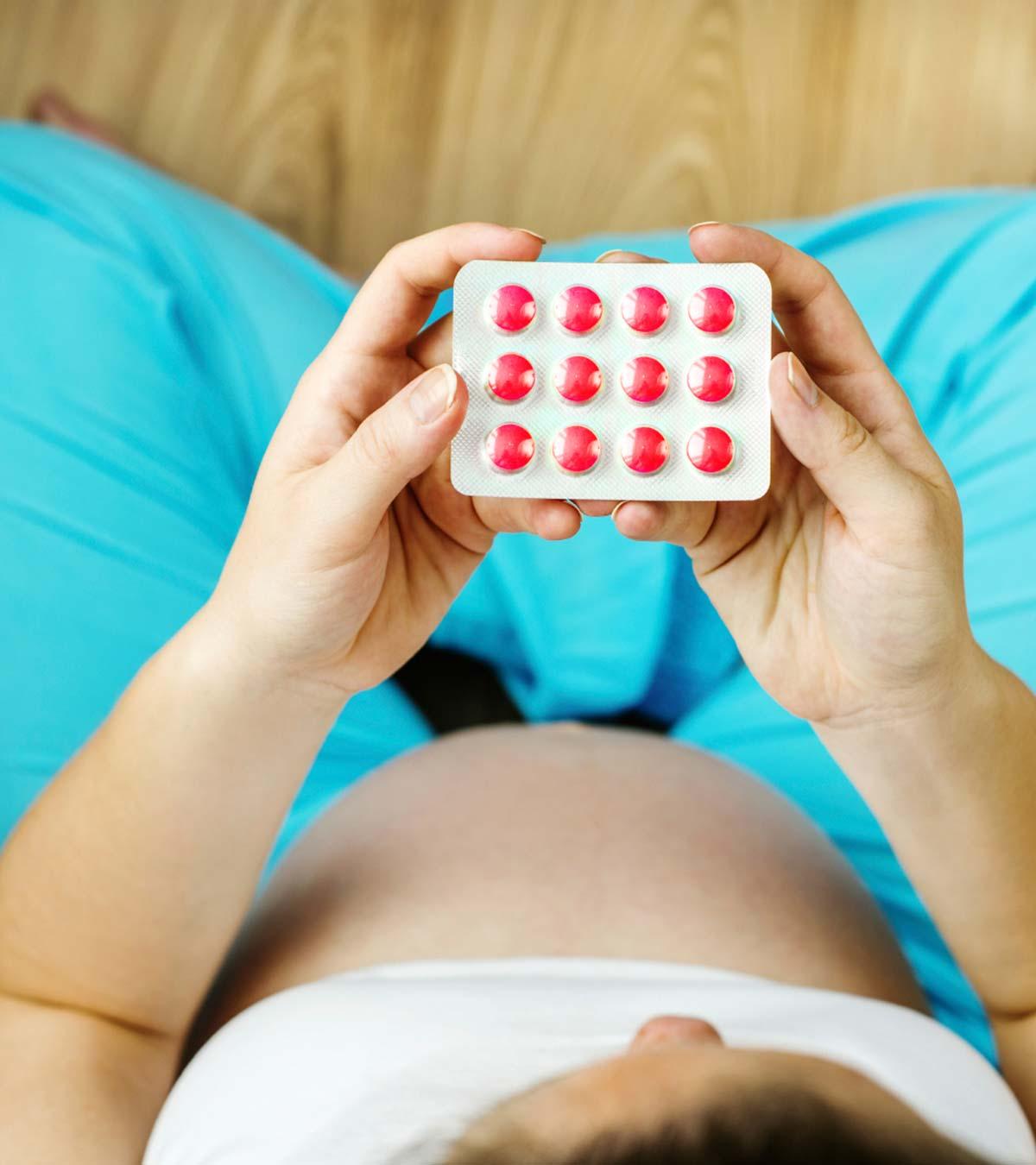 Pregnant Woman Holding Medication