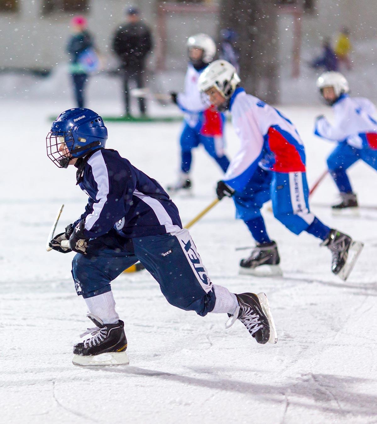 People are playing ice hockey