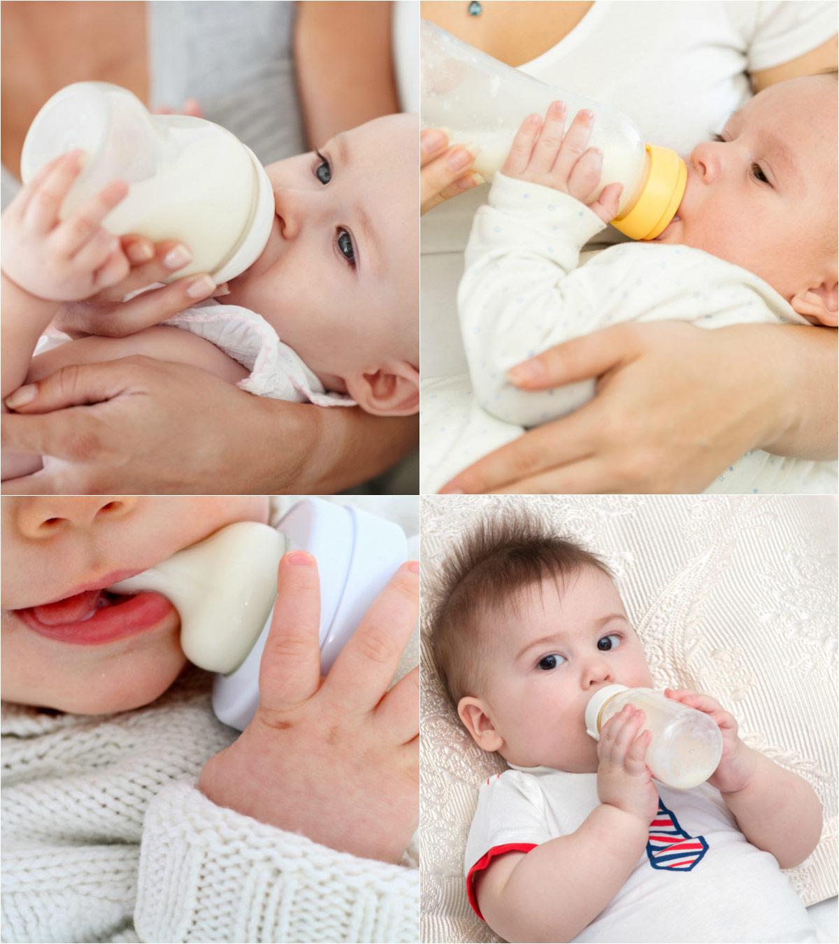 Baby holds milk bottle