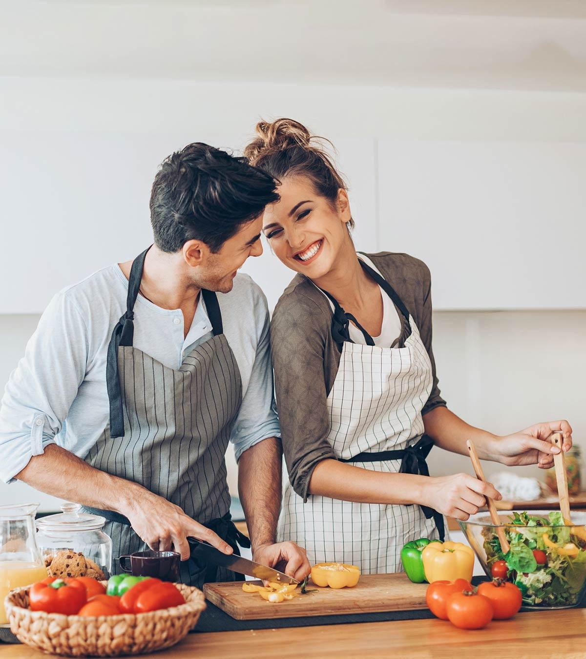 A Husbanf Helping His Wife In Kitchen