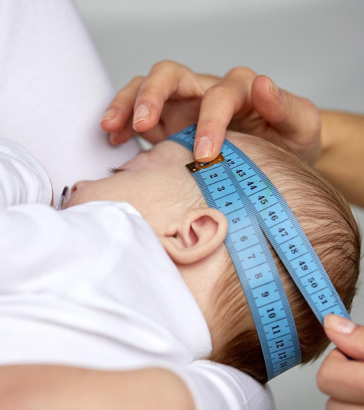 A person measuring a baby