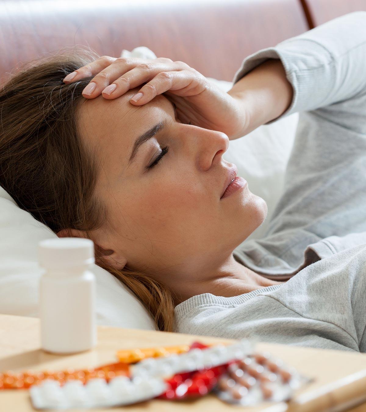A lady suffering from a headache