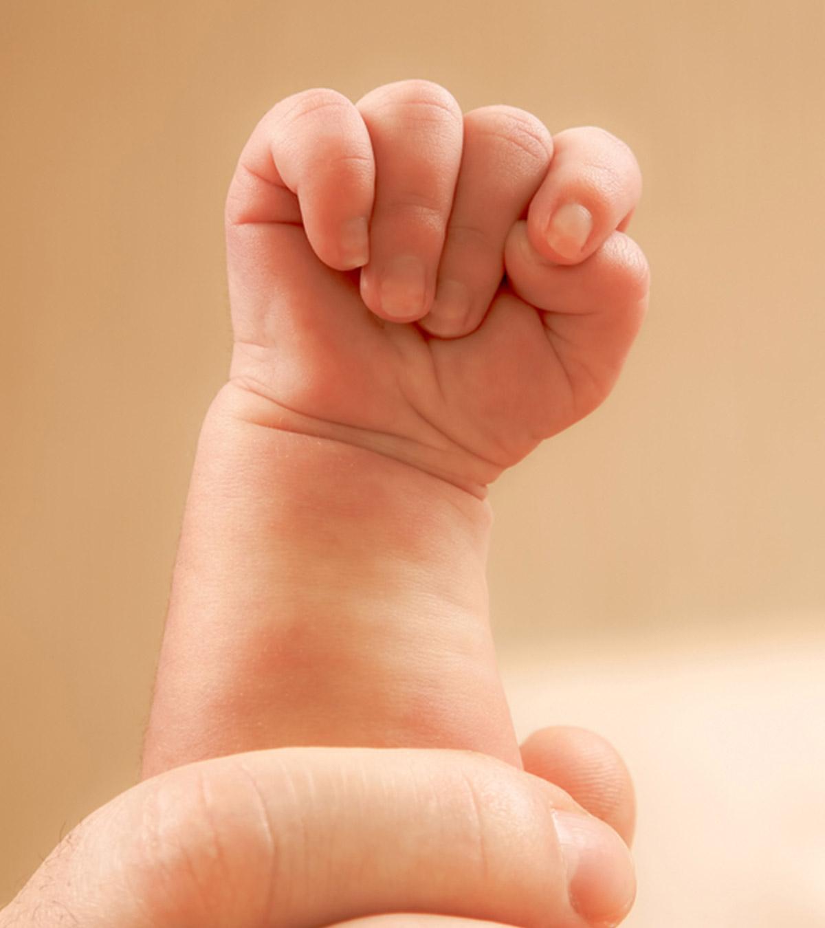 Baby Clenching Tiny Fists