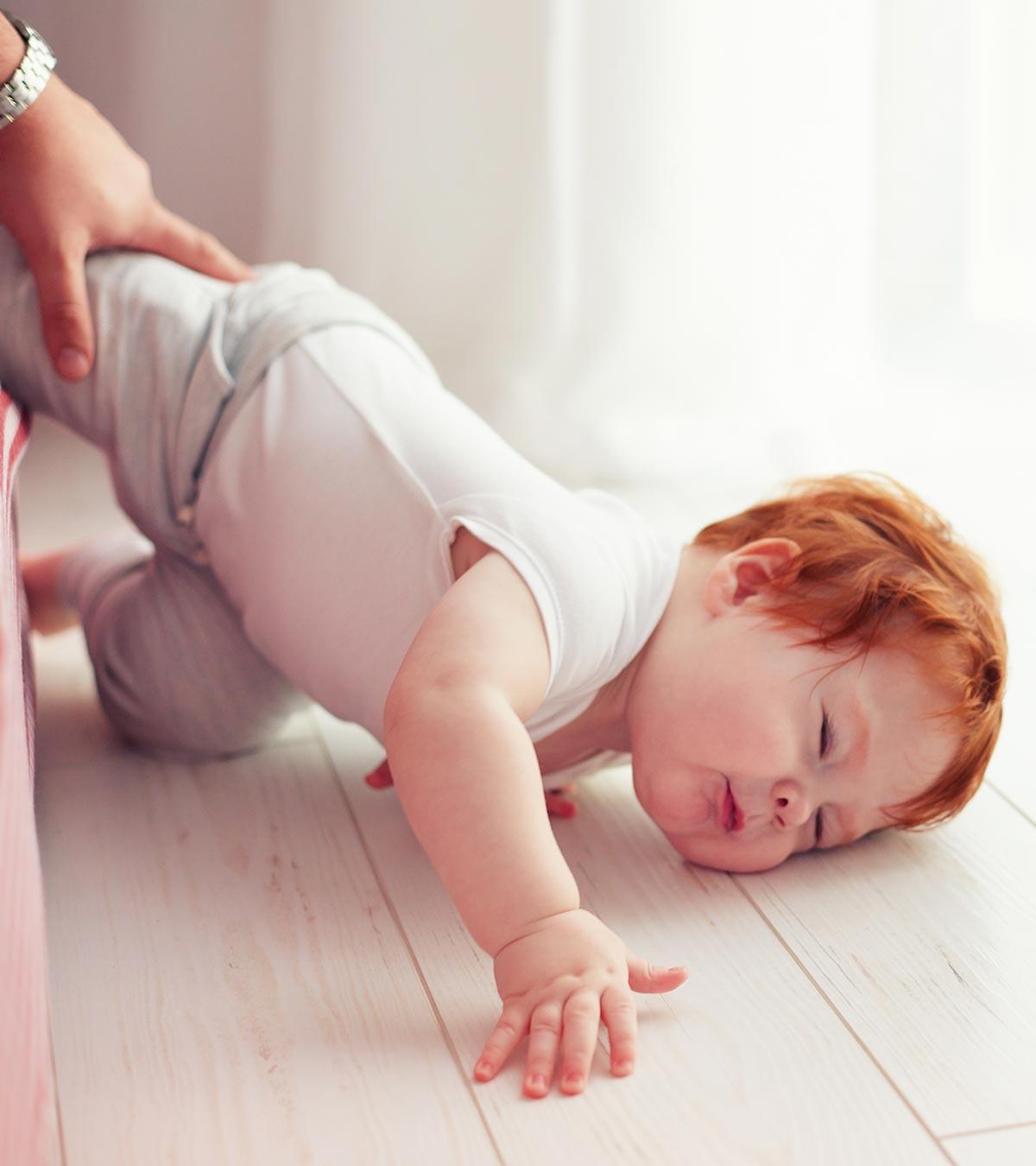 A Baby Falling Off From The Bed