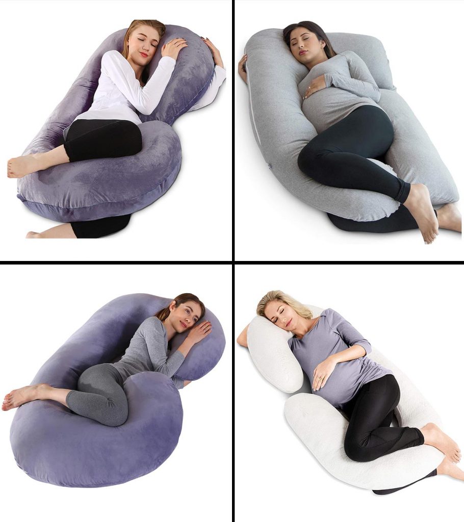 Woman lays on pregnancy pillow